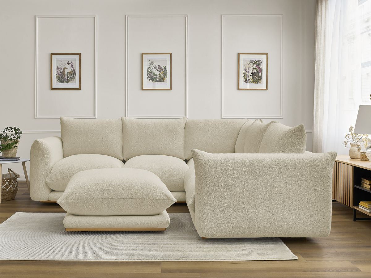 Hjørnesofa ERNEST i bouclé-stoff med puff