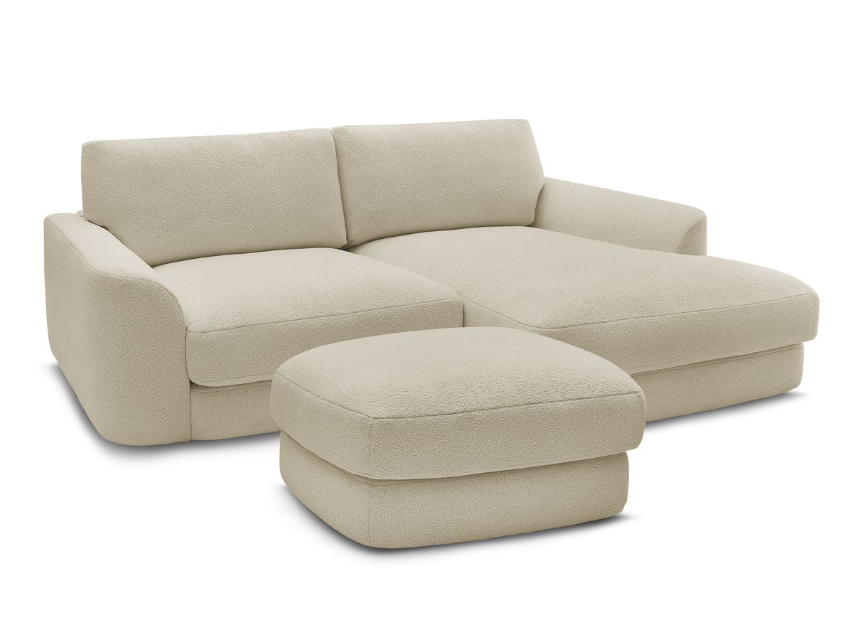 Hjørnesofa LEONORE i bouclé-stoff med puff