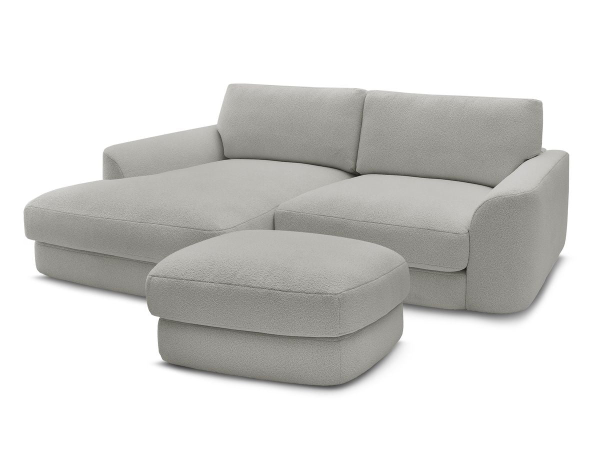 Hjørnesofa LEONORE i bouclé-stoff med puff