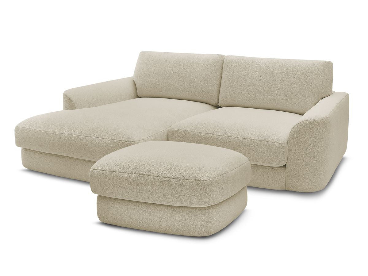 Hjørnesofa LEONORE i bouclé-stoff med puff