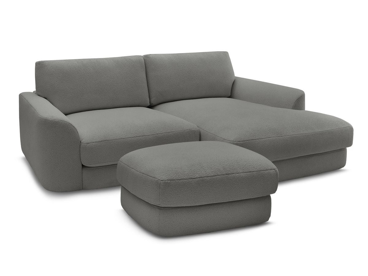Hjørnesofa LEONORE i bouclé-stoff med puff