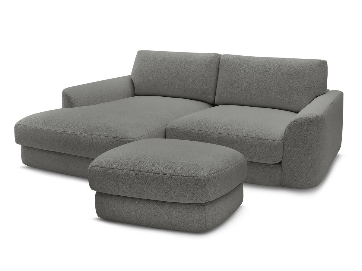 Hjørnesofa LEONORE i bouclé-stoff med puff